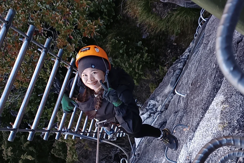 Climber on the Mount Kinabalu via ferrata rungs